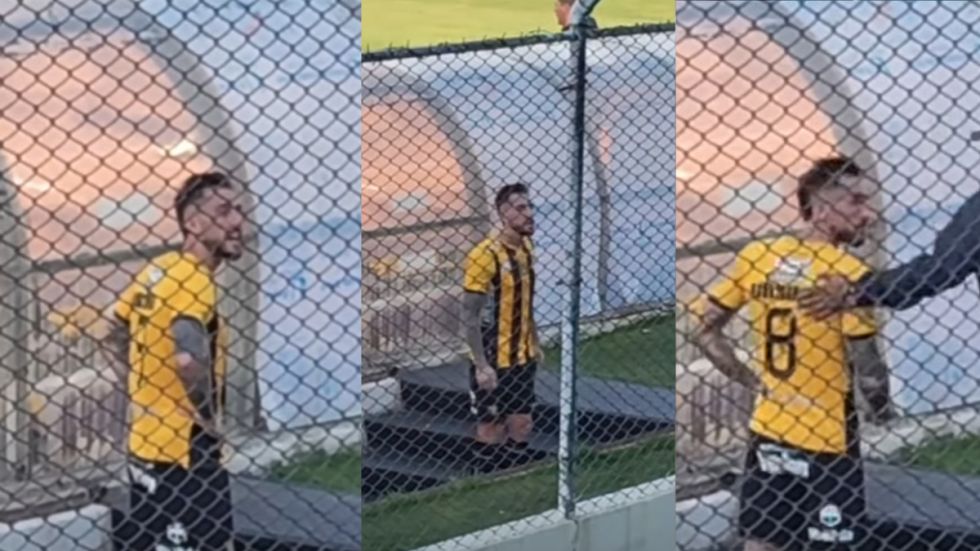 Cruce de Ursino con un hincha cuando salía tras ser expulsado 